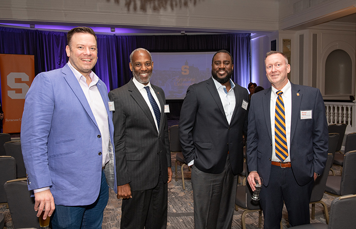 Vice Chancellor Mike Haynie takes a picture with some guests.